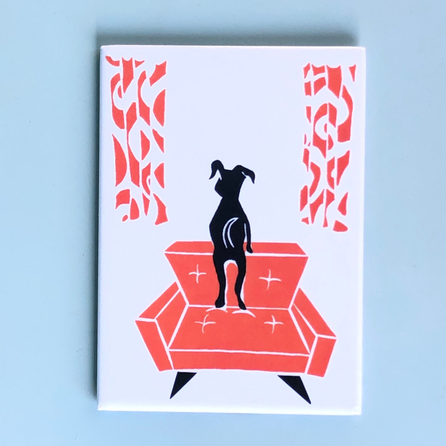 Stylized black dog looking out a window, standing on a red-orange midcentury modern chair w/ matching curtains on a white background.