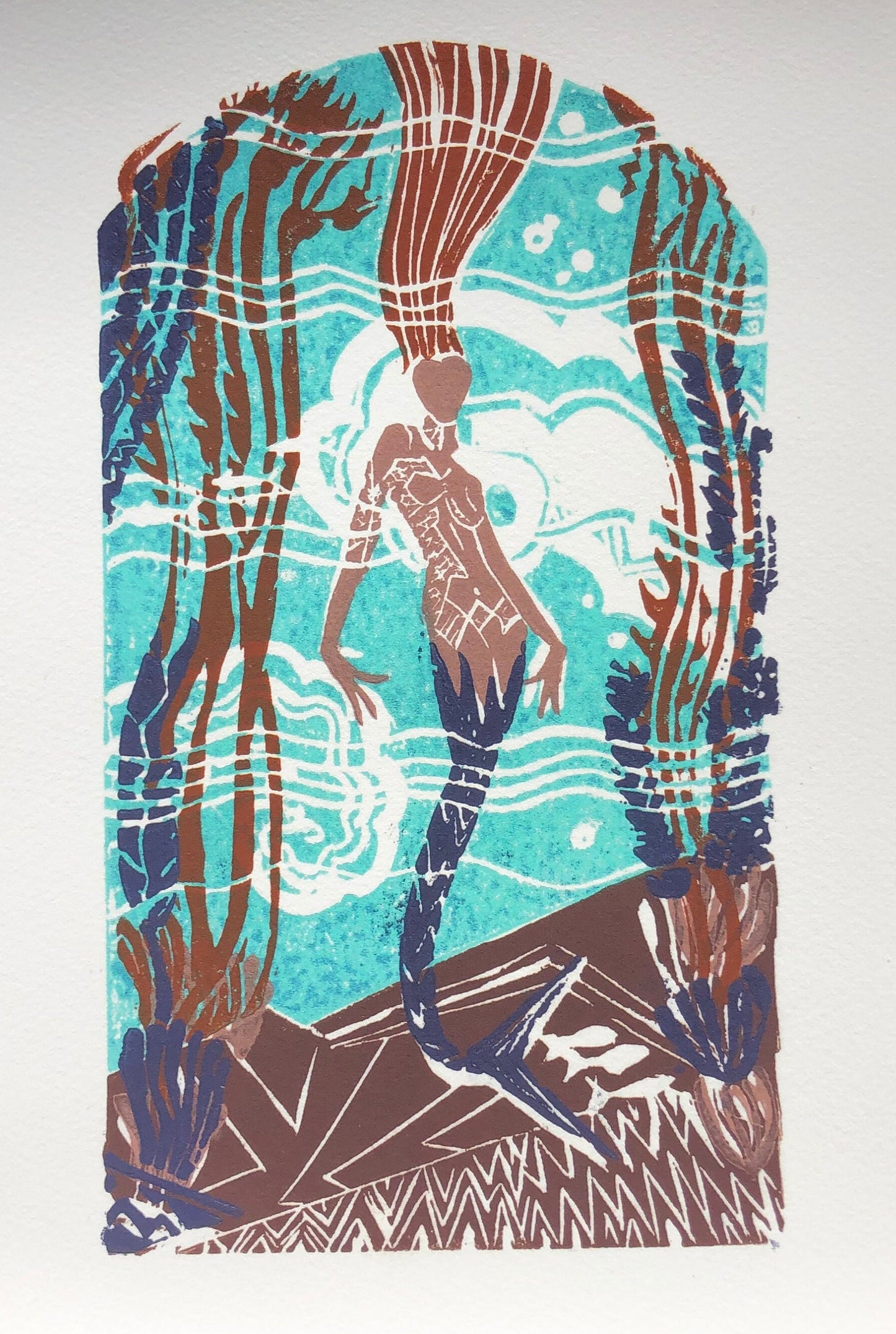 Giclée print of original 5-plate linocut depicting an art deco tile mosaic of the Catalina Casino Mermaid. Bright turquoise back ground with white water movement, stylized mermaid with purple tail and auburn flowing hair, surrounded by kelp, coral, and fish.