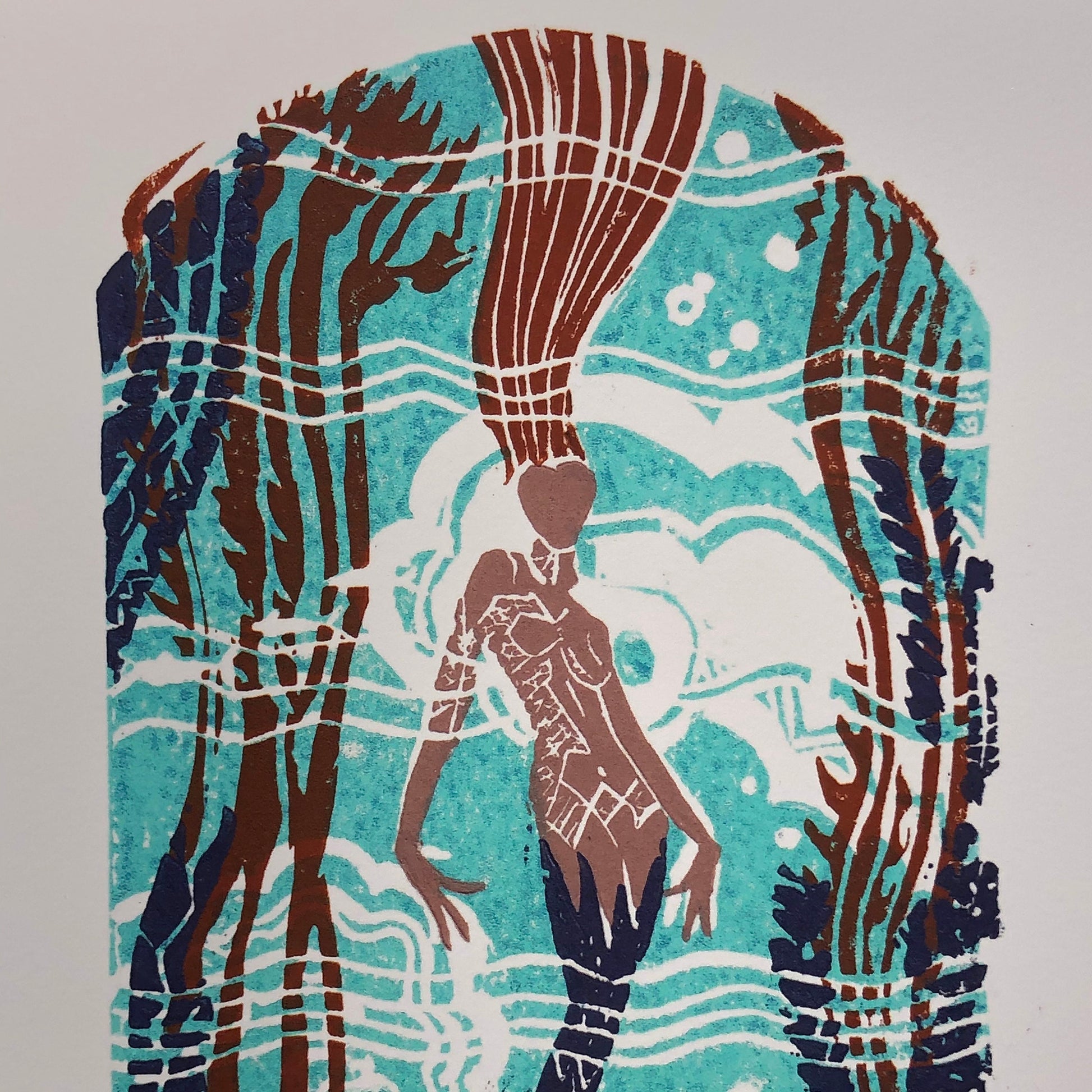 Zoomed in view of upper half of giclée print of original 5-plate linocut depicting an art deco tile mosaic of the Catalina Casino Mermaid. Bright turquoise back ground with white water movement, stylized mermaid's auburn hair, purple tail surrounded by kelp, coral, and fish.